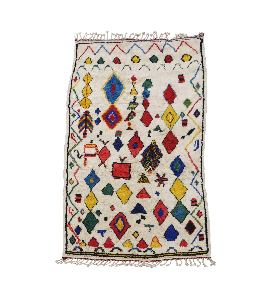 Colorful geometric patterned rug on a white background