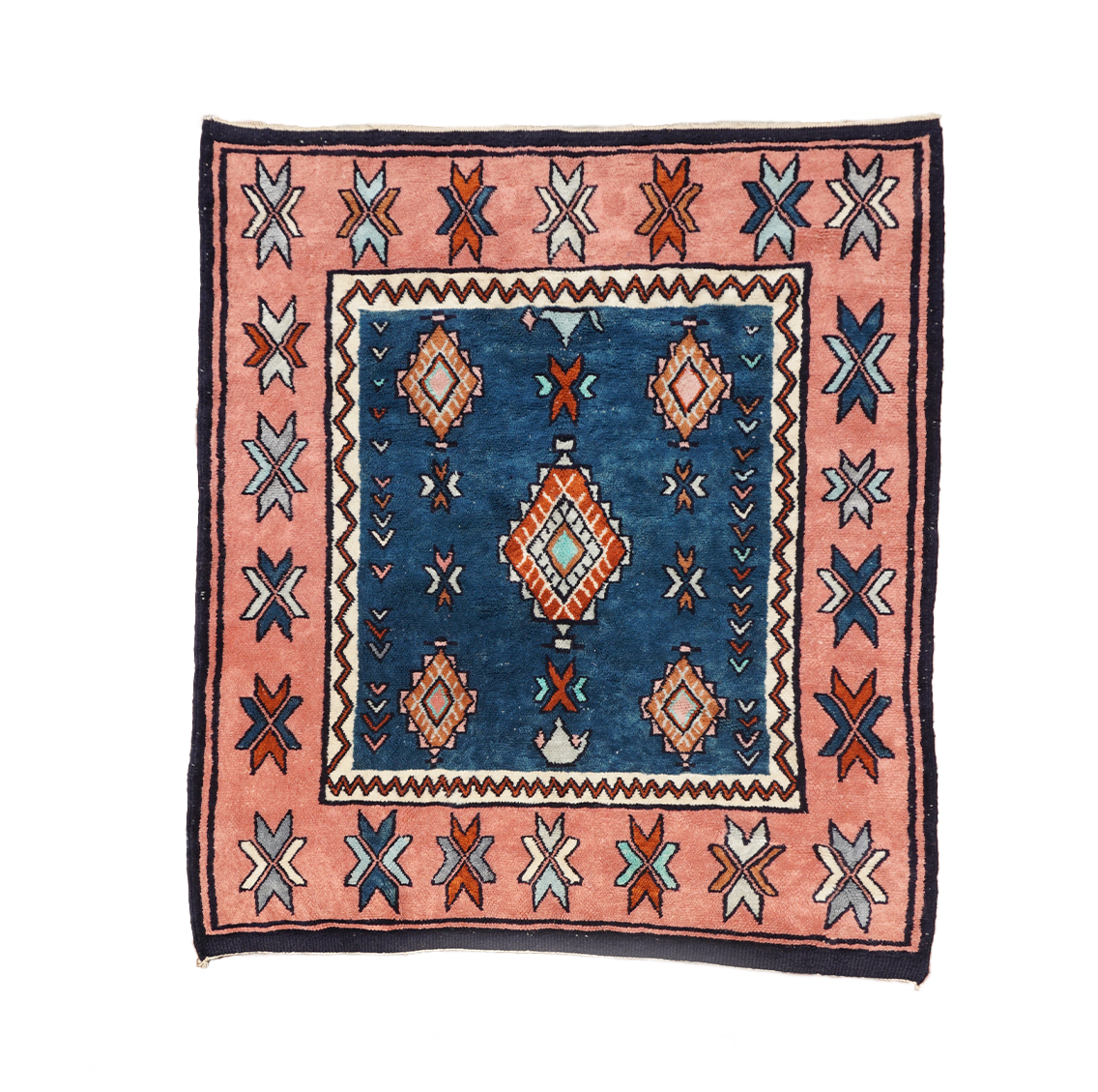 Decorative Moroccan rug with geometric pattern on a white background