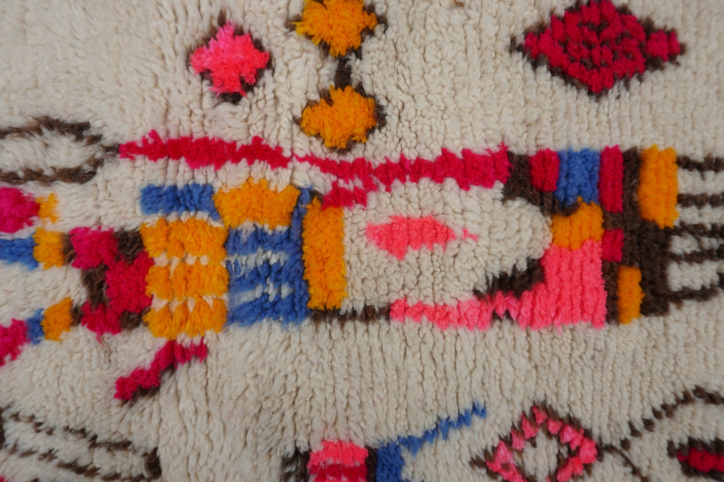 Close-up of a colorful woven textile with geometric patterns