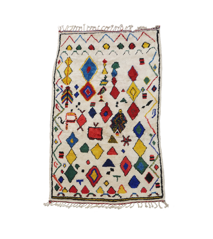 Colorful geometric patterned rug on a white background